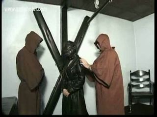 Dungeon full of horny masters ties scared slave to a wall an